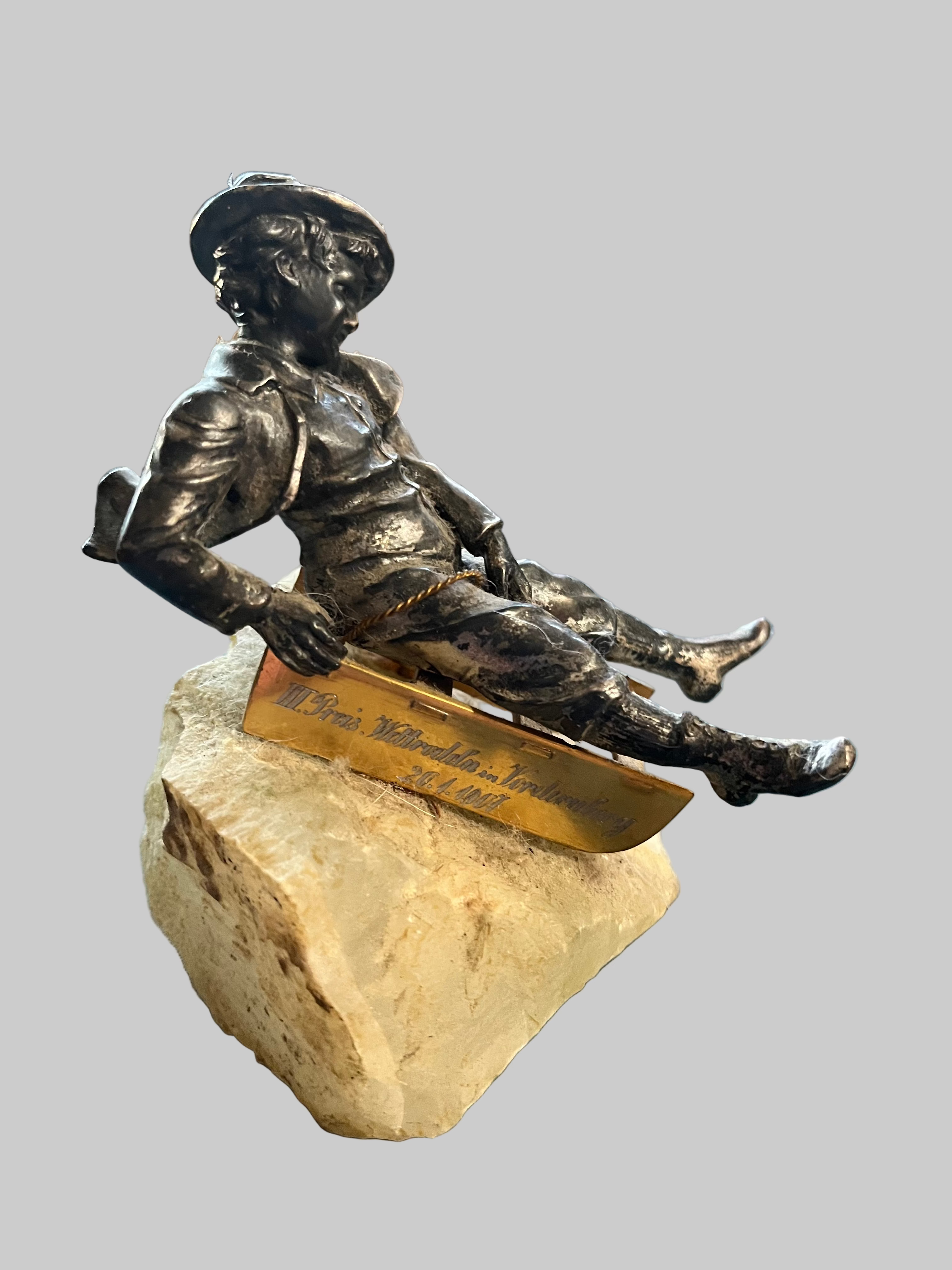 Boy sled figurine